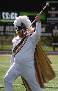 Drum major takes the field during a Homecoming performance